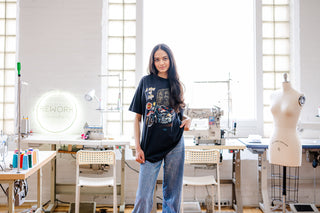 Model wearing harley davison tee with a sewing studio in background